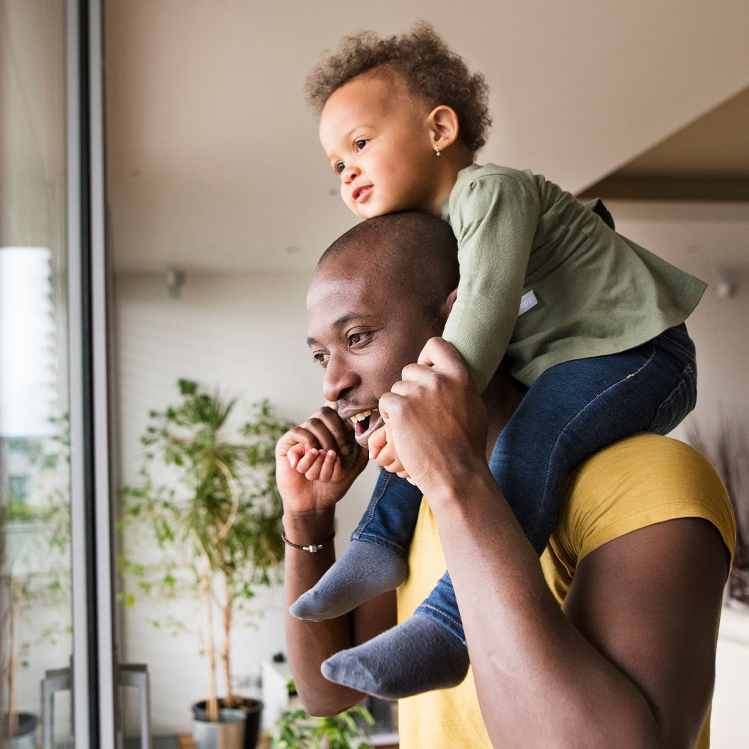father with child on shoulders - thinking about a diverse workforce