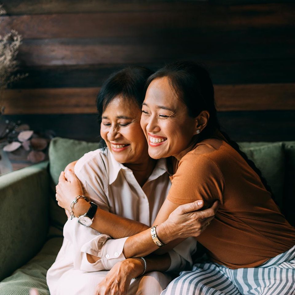 Young woman hugging her mother