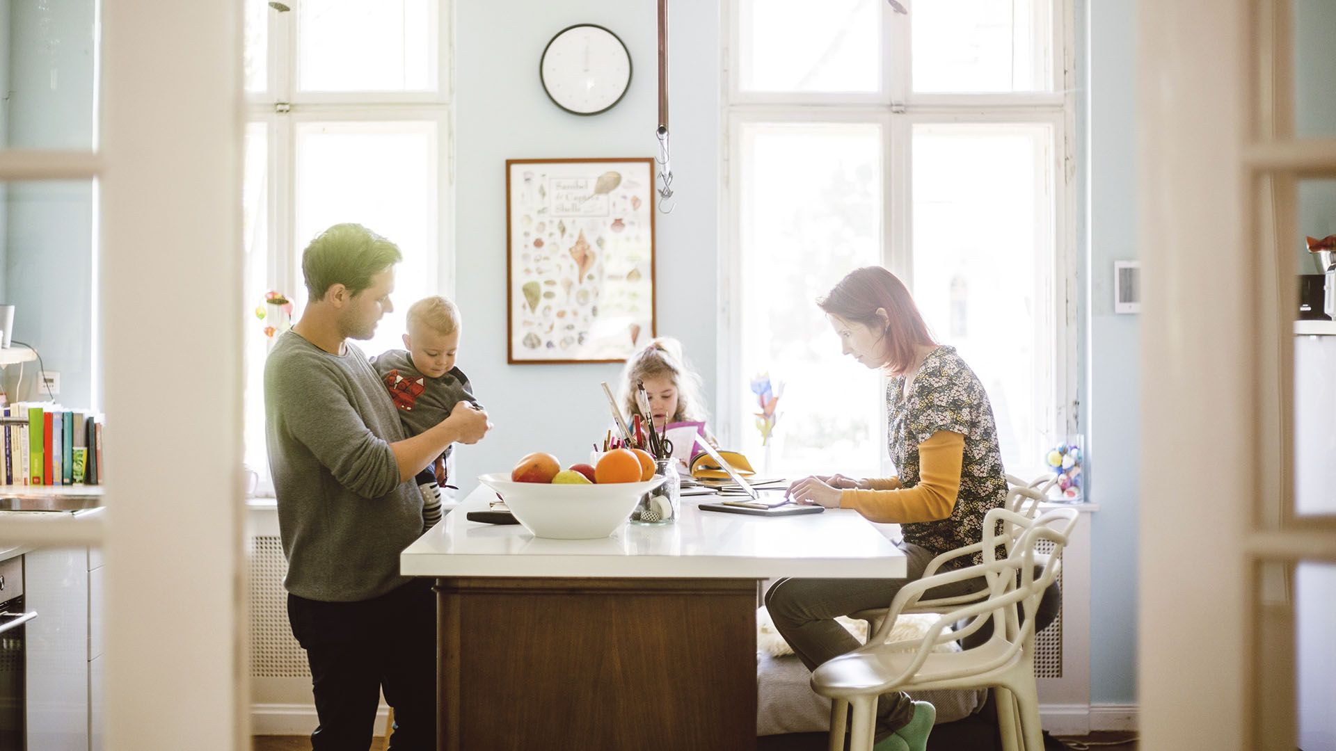 family sitting around breakfast table
