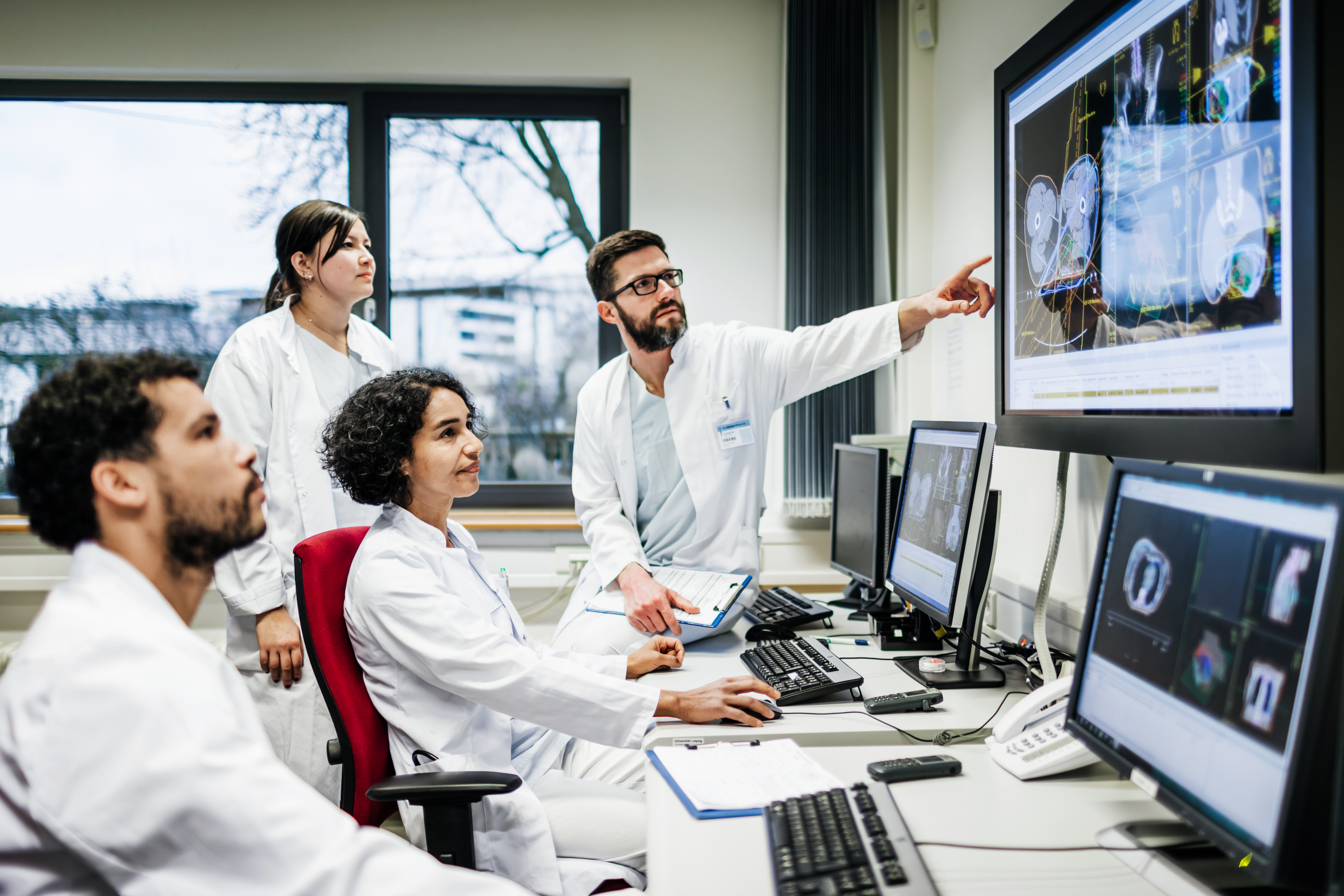group of doctors reviewing scans