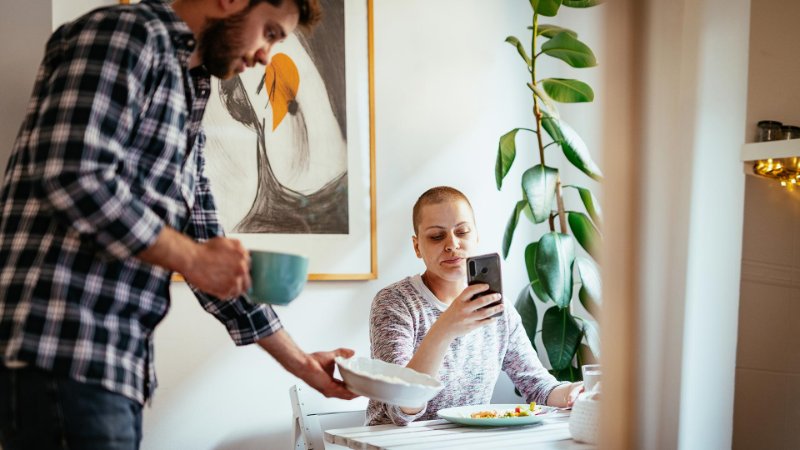 husband helps partner with dinner