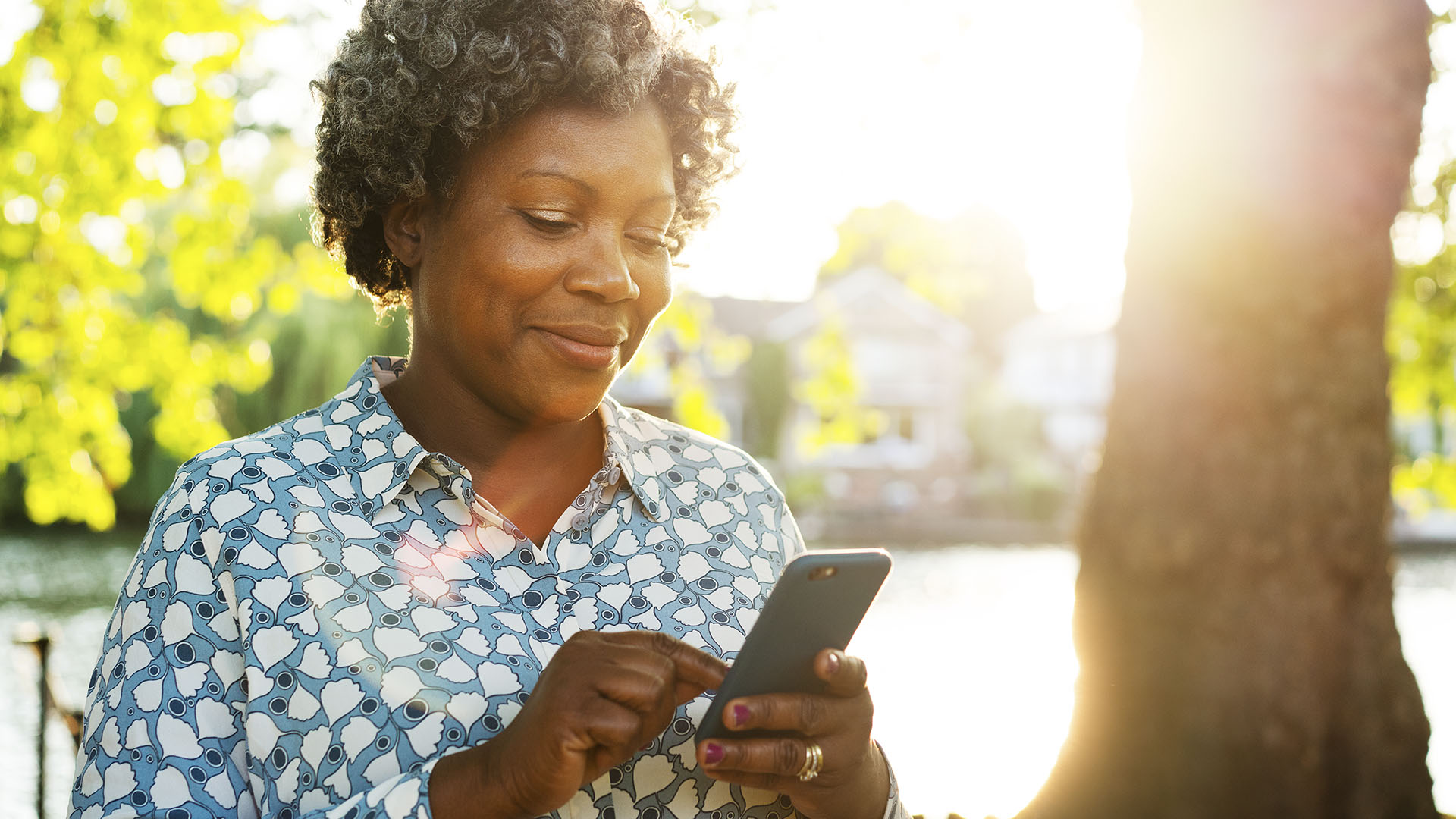 senior lady reviewing health care options on her phone