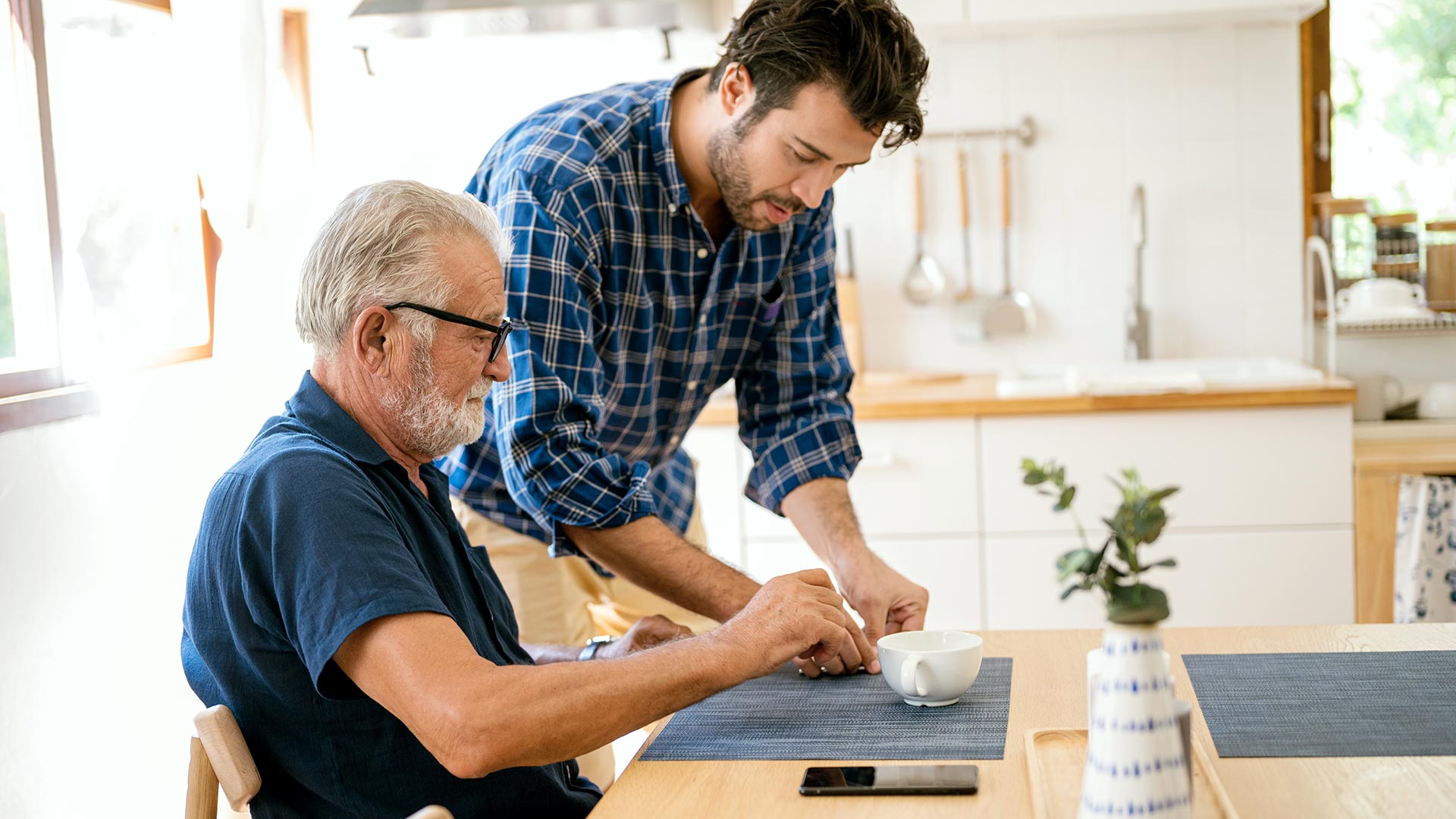 son helping his father with retiree health
