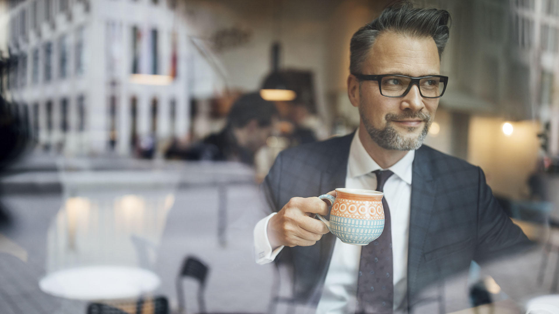 Businessman looking at news report about ERISA and the end of Covid emergency