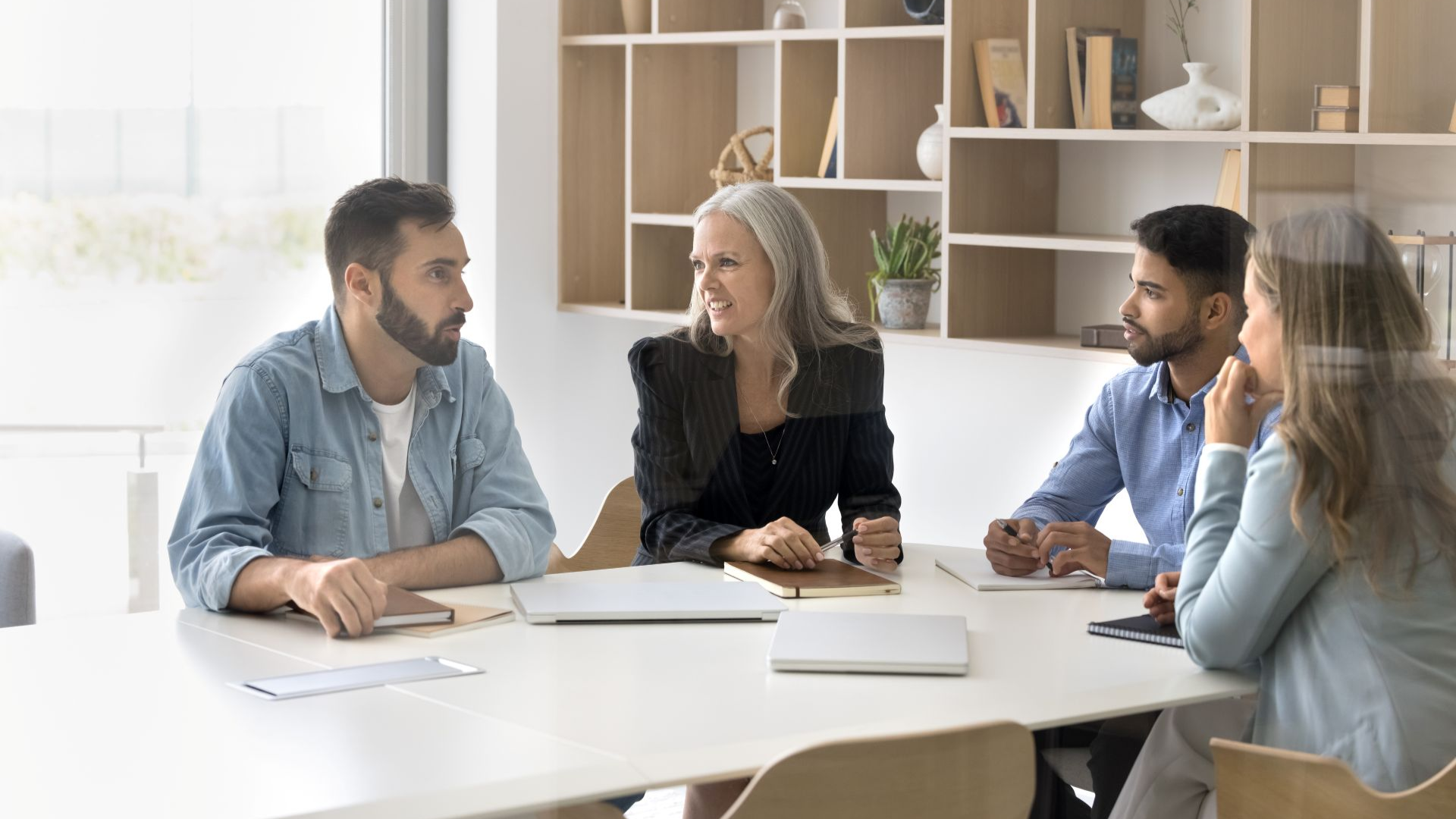 office workers discussing ai and retirement benefits