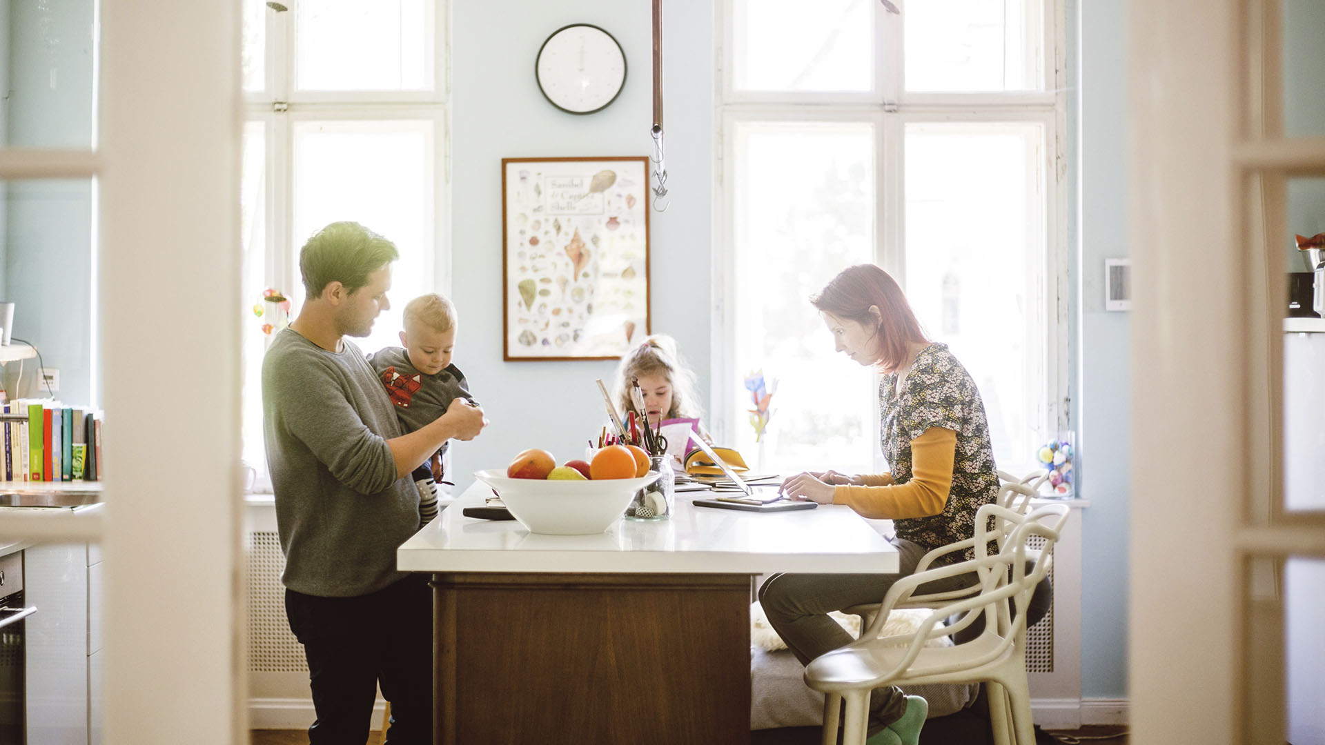 family sitting around breakfast table
